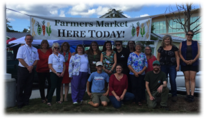 Local farmers, volunteers and staff of the Strafford County Public Health Network gather to close out the inaugural season of the Somersworth Farmers Market.